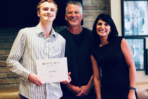 prize winner posing with jury members