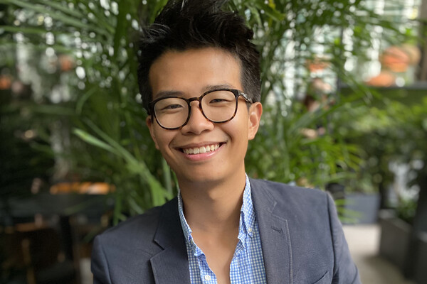 besopectacled young asian man smiling