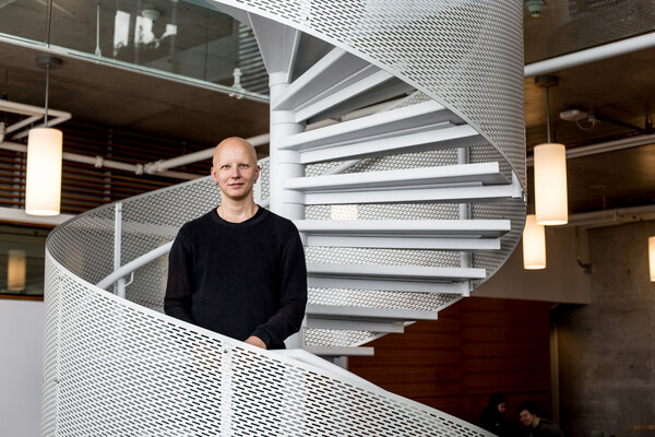 mikko taipale standing on spiral staircase in shape of DNA